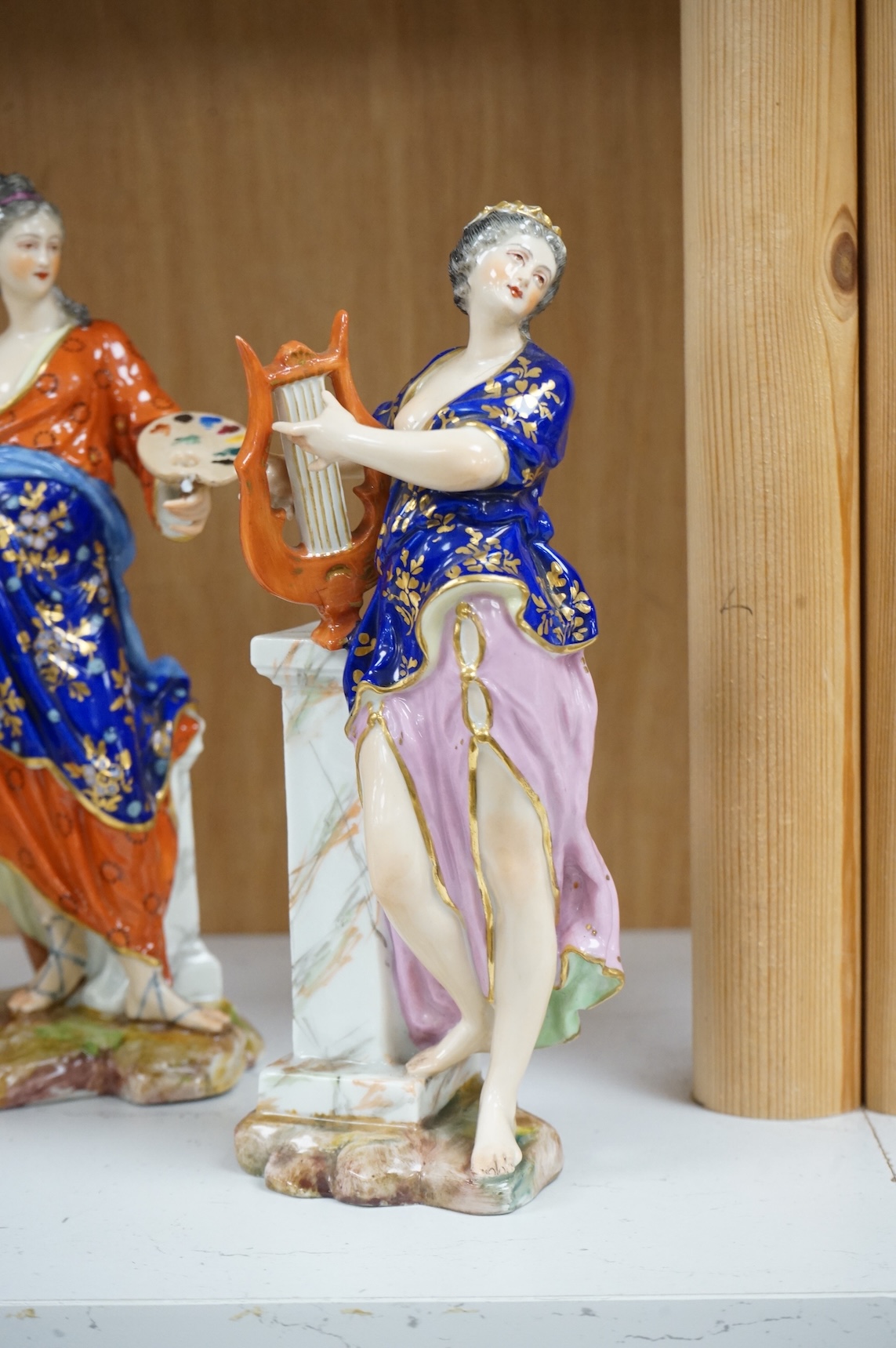 A set of four French Derby style porcelain figures, emblematic of art, sculpture, music and theatre, tallest art 22.5cm high